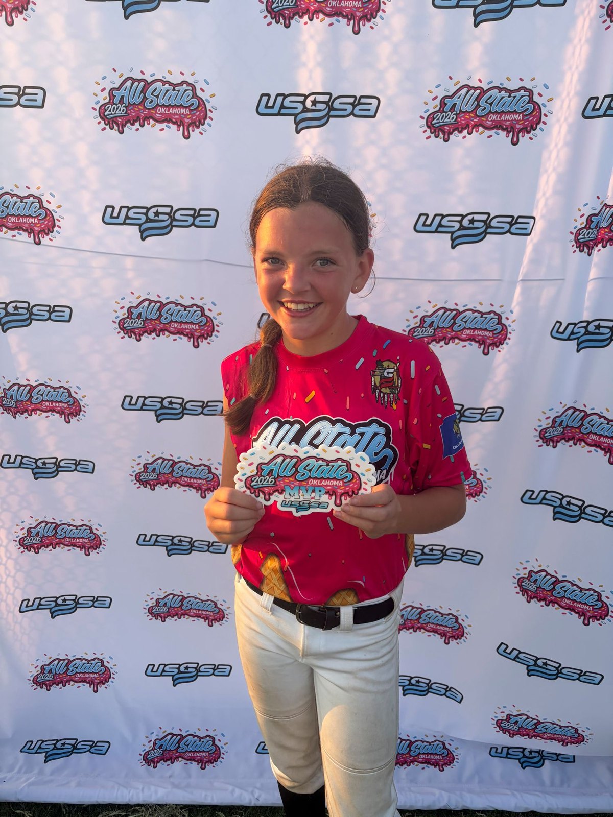 Genevieve holding her USSSA Oklahoma All State MVP award